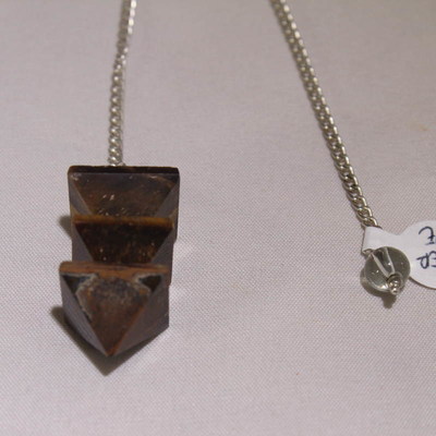Tiger Eye (Layered Pyramid) Pendulum with clear crystal bead on the end of the chain.